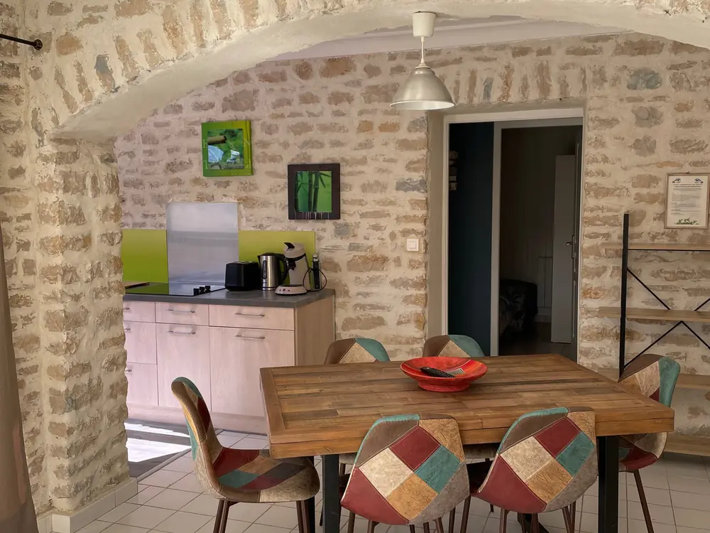 Stone-vaulted living area of Gîte Agora
