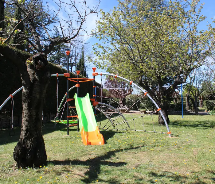 Play area with slide and climbing frame